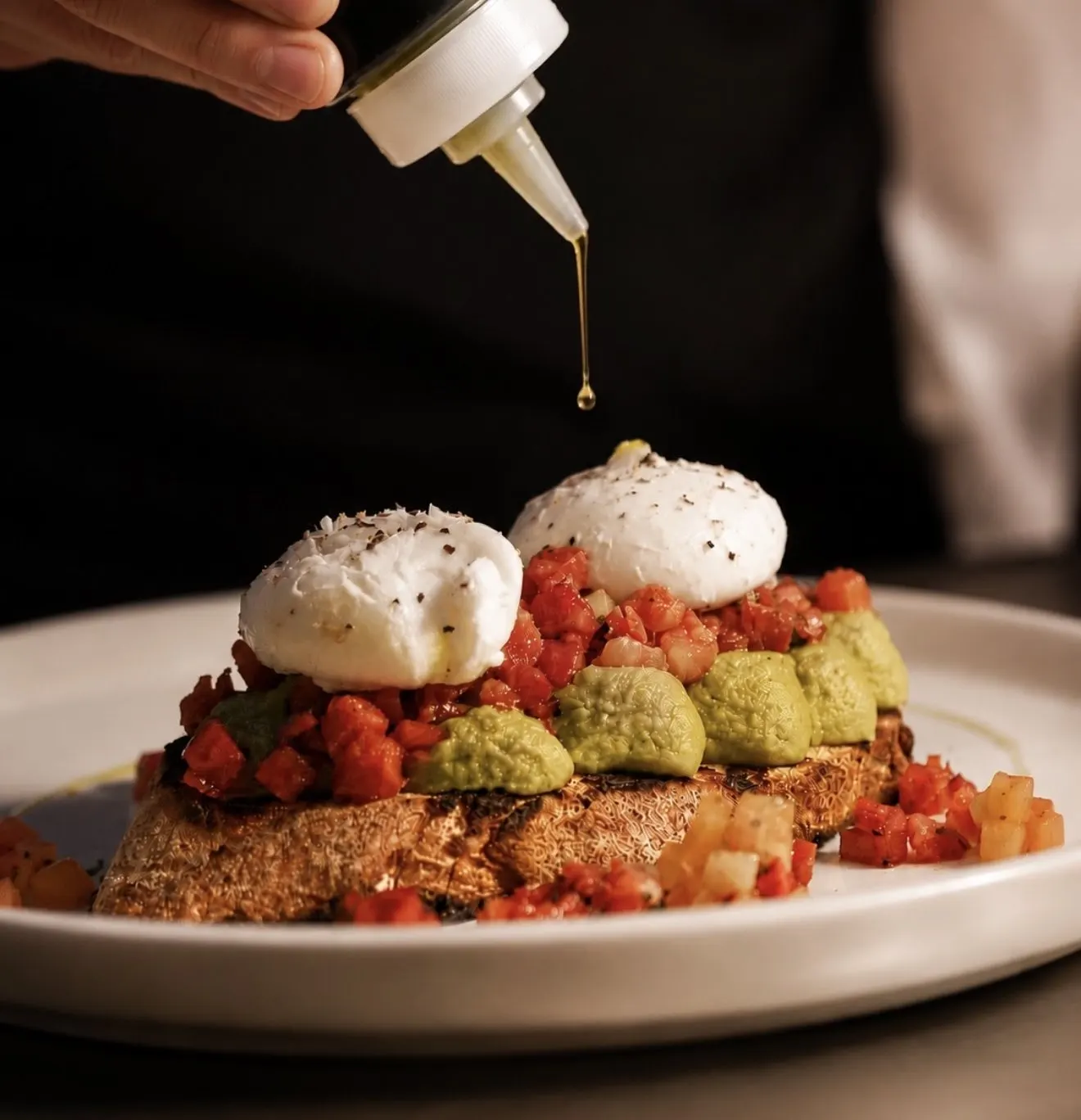 Smashed avocado with poached eggs on sourdough
